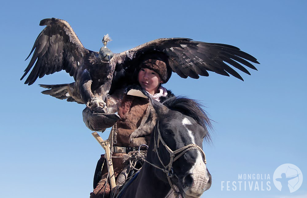Mongolian Eagle Huntress Zamanbul with her golden eagle