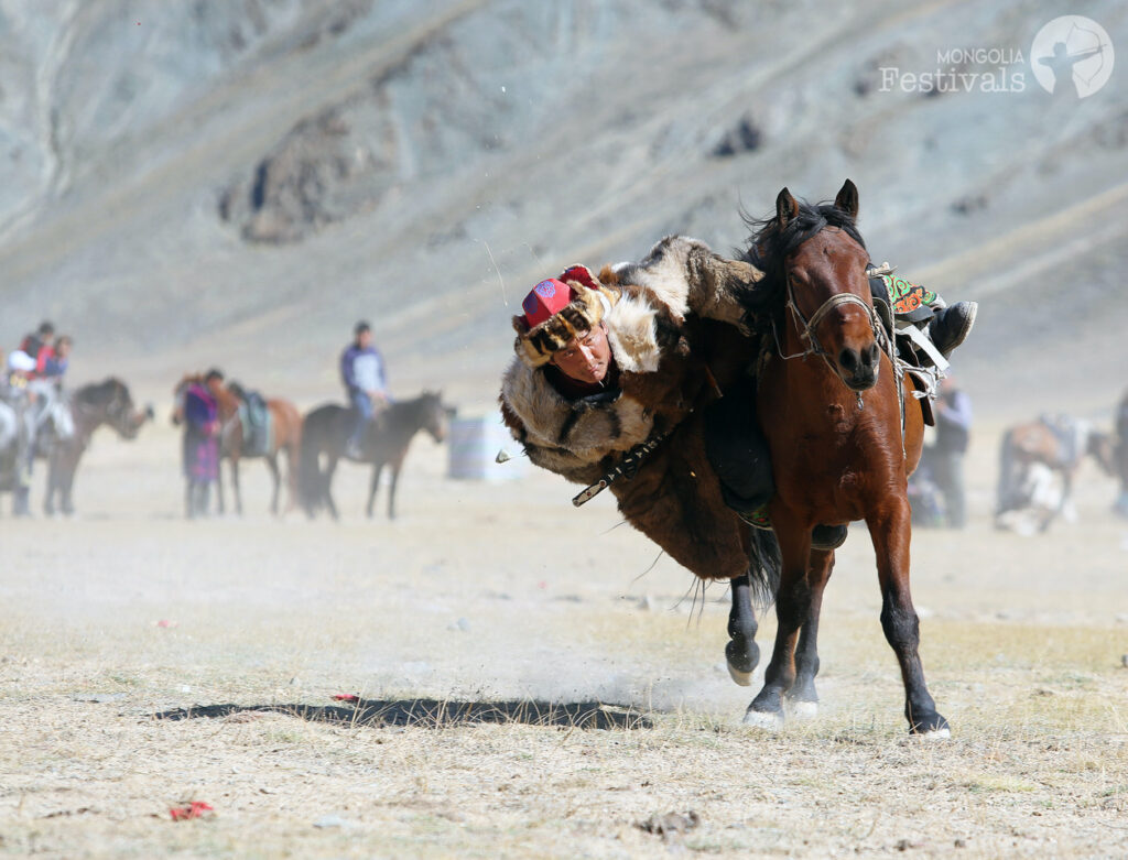 Picking up coin tournament Golden Eagle Festival